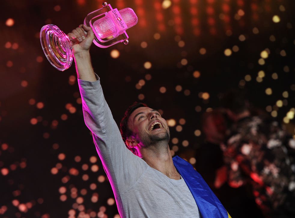 Sweden's Mans Zelmerlow lifts the trophy after winning the Eurovision Song Contest in 2015