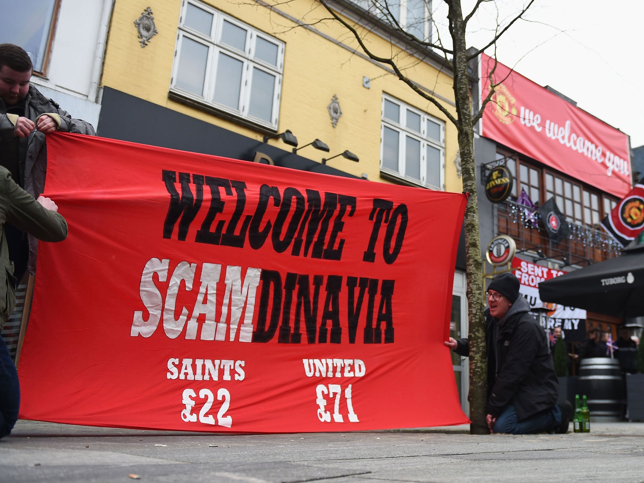 Manchester United fans protest against ticket prices for the Europa League tie with Midtjylland