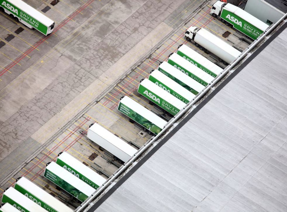 Delivery freight trucks at an Asda distribution depot in Bristol