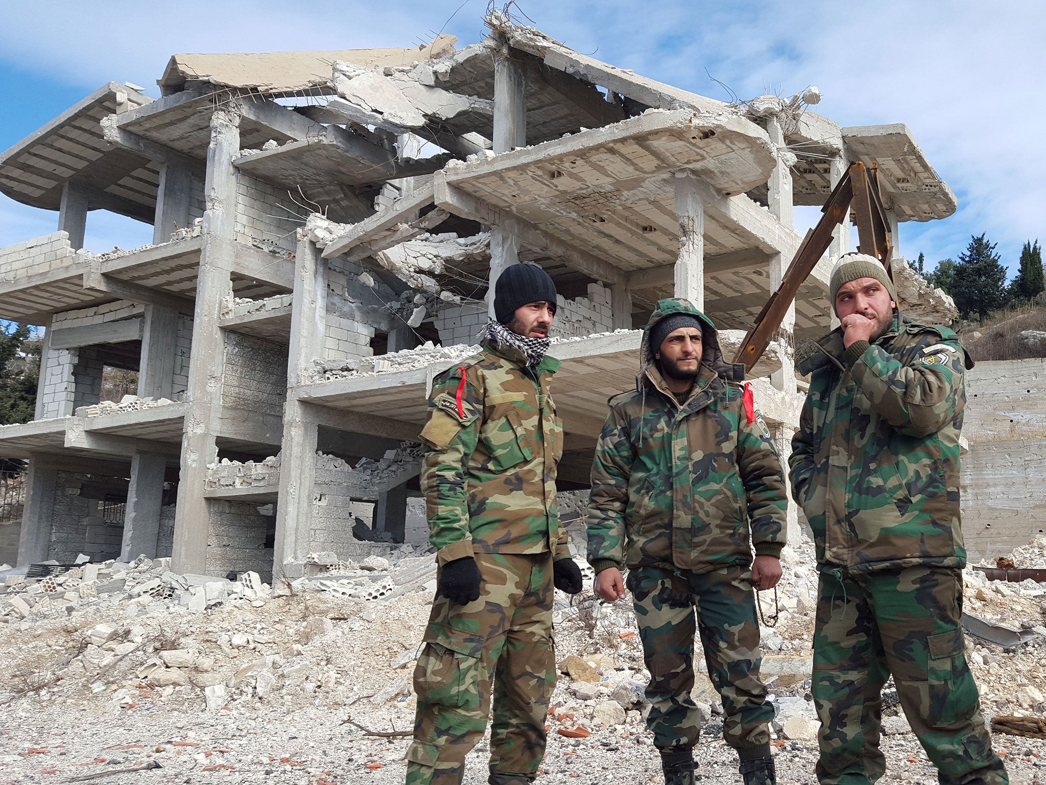 Pro-government Syrian forces in al-Rabiaa who have recently taken the town from rebels