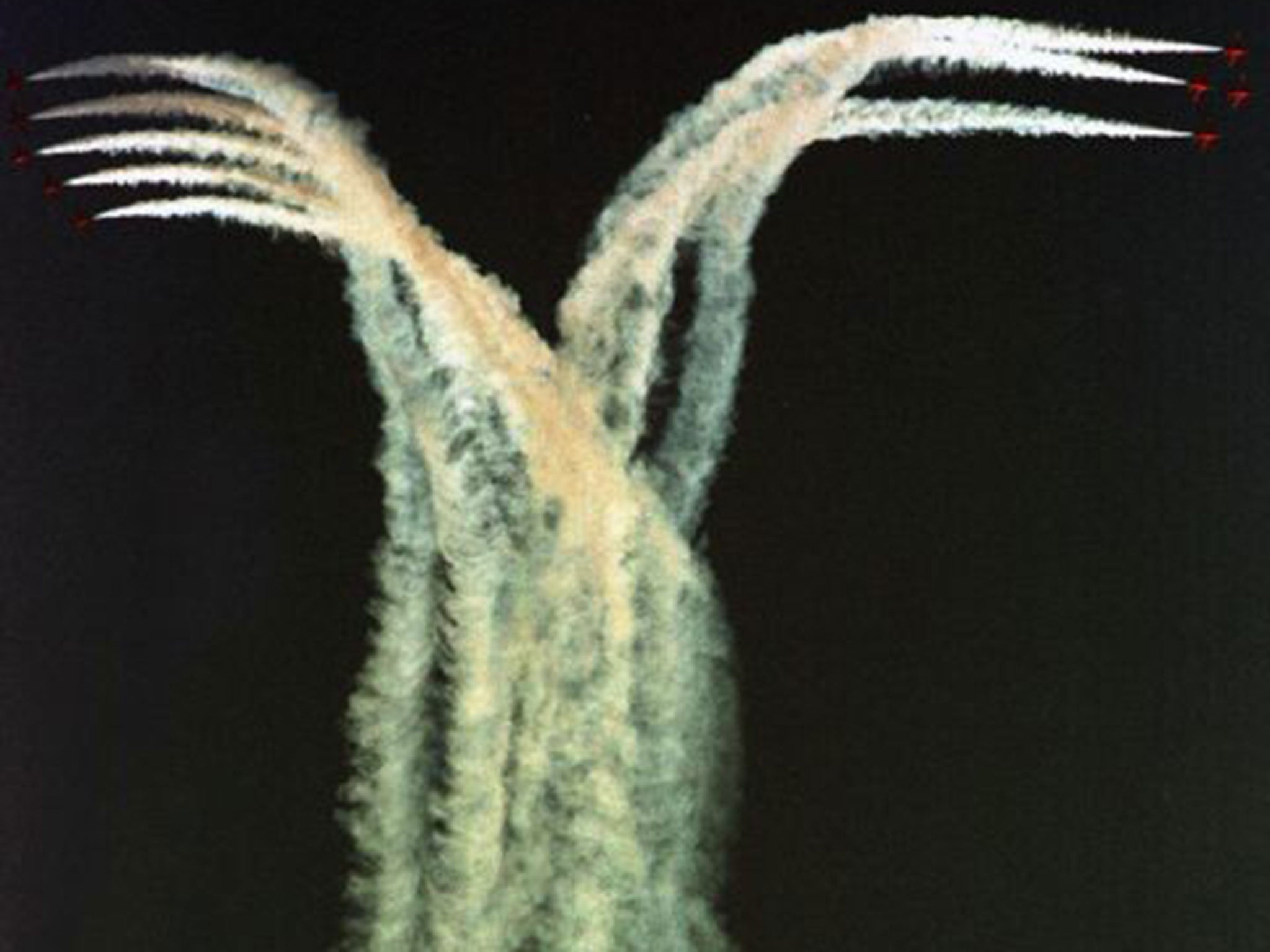 BAE Hawks, used by the Red Arrows, stage a flyover in Egypt in 2003