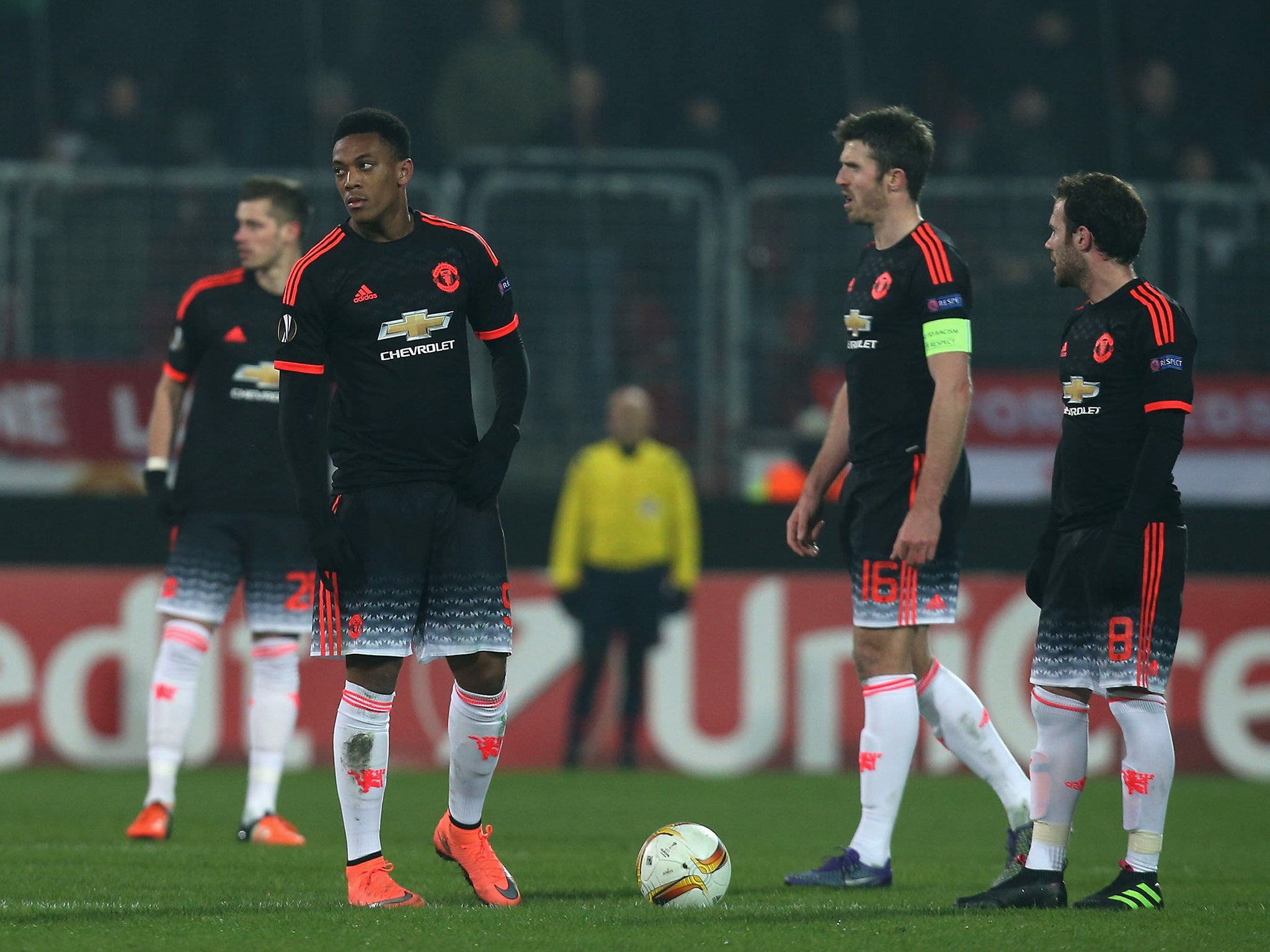 Manchester United look on as Midtjylland celebrate their winning goal