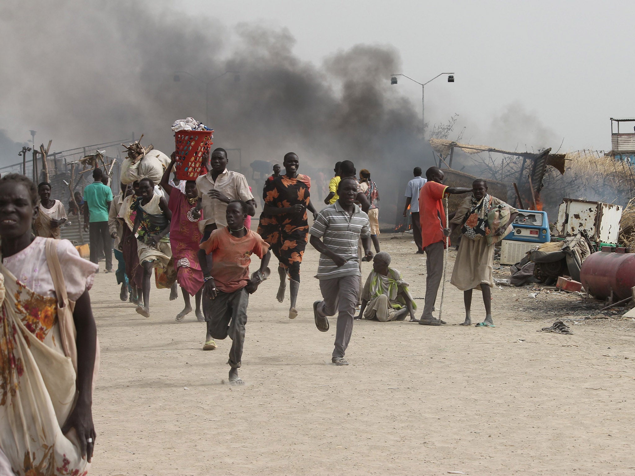 Refugees flee from clashes between ethnic groups in the Malakal refugee camp in South Sudan