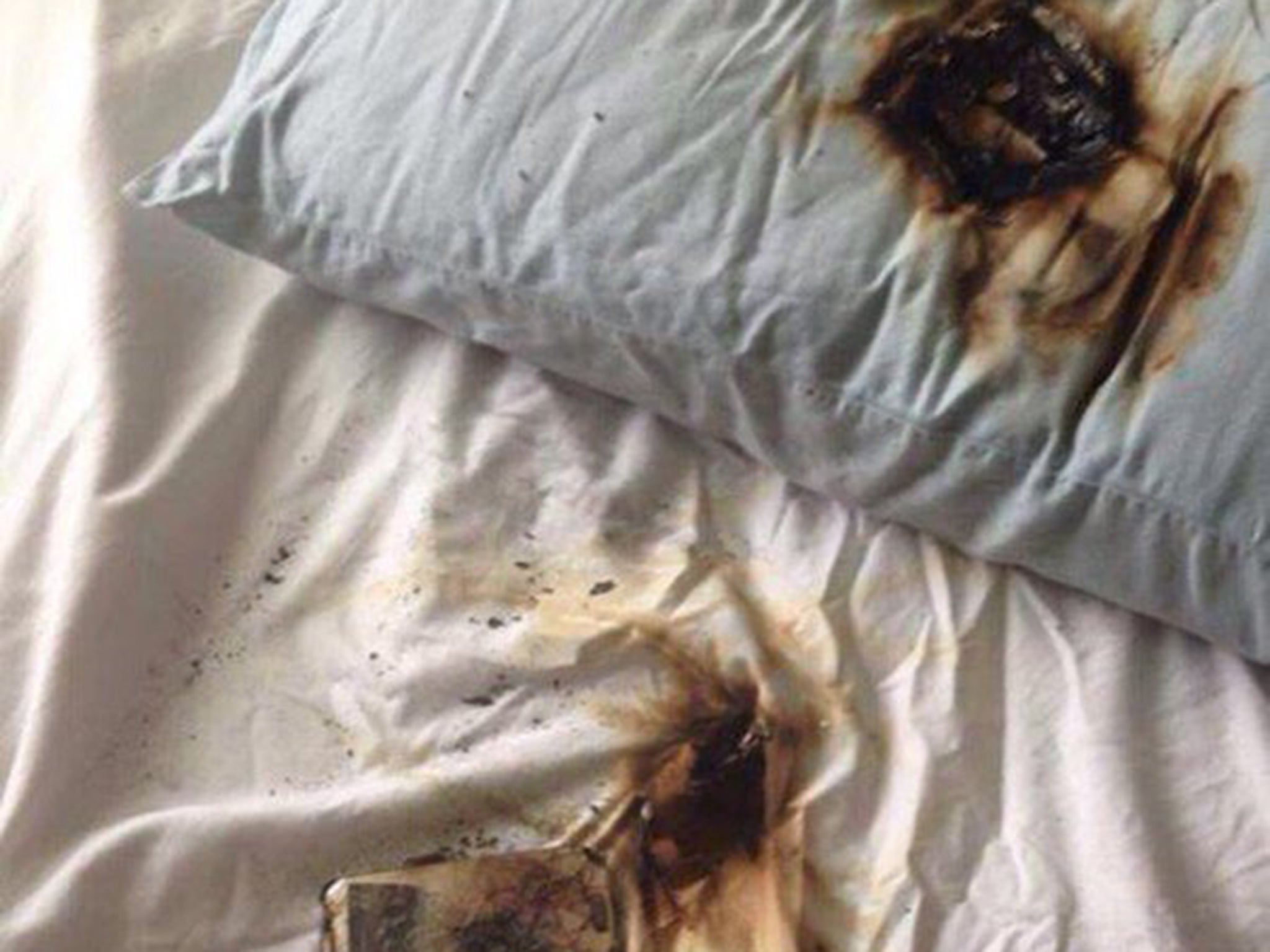 Photos show burned pillow and mattress