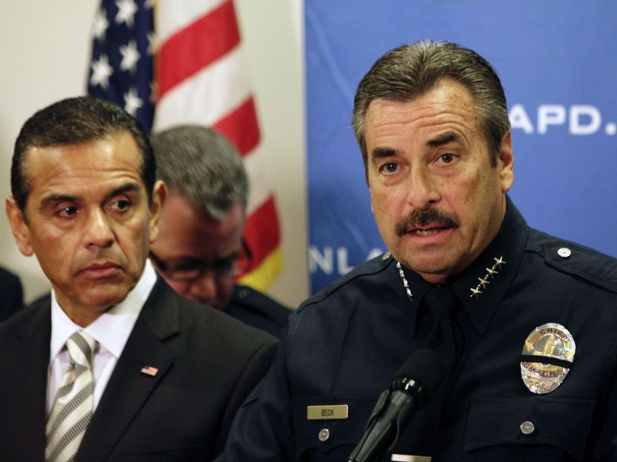 Police chief Charlie Beck (right) called any effort to arrest and deport people a ‘monumental task’ and estimated that there are 500,000 undocumented residents in the city of Los Angeles alone