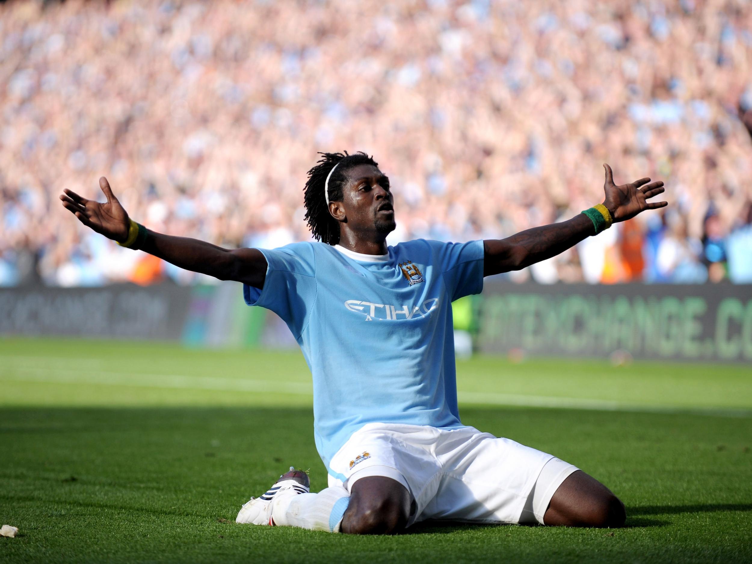 Emmanuel Adebayor celebrates in front of the Arsenal supporters in 2009