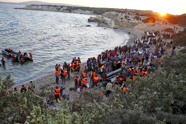 Refugees gather at a beach to try to sail off for the Greek island of Chios from the western Turkish coastal town of Cesme