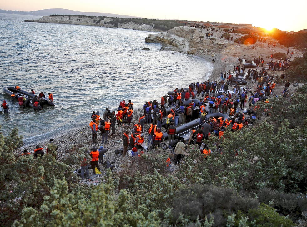 Refugees gather at a beach to try to sail off for the Greek island of Chios from the western Turkish coastal town of Cesme