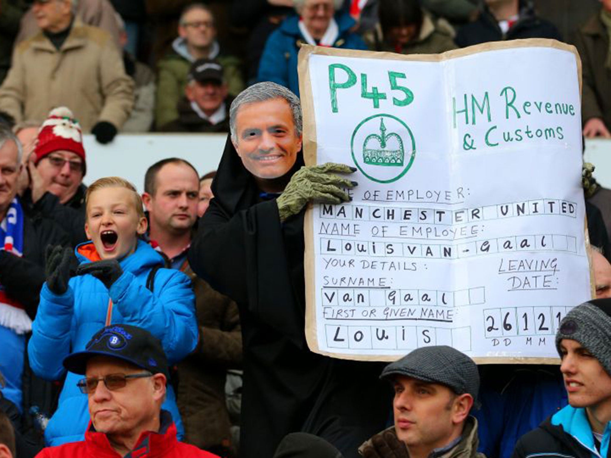 A fan poses as Jose Mourinho during a Man Utd vs Stoke match