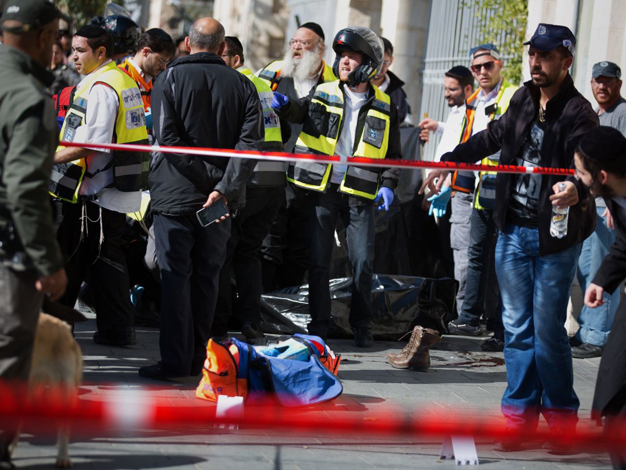 Security forces surround the body of a Palestinian girl who was shot dead while brandishing scissors in Jerusalem