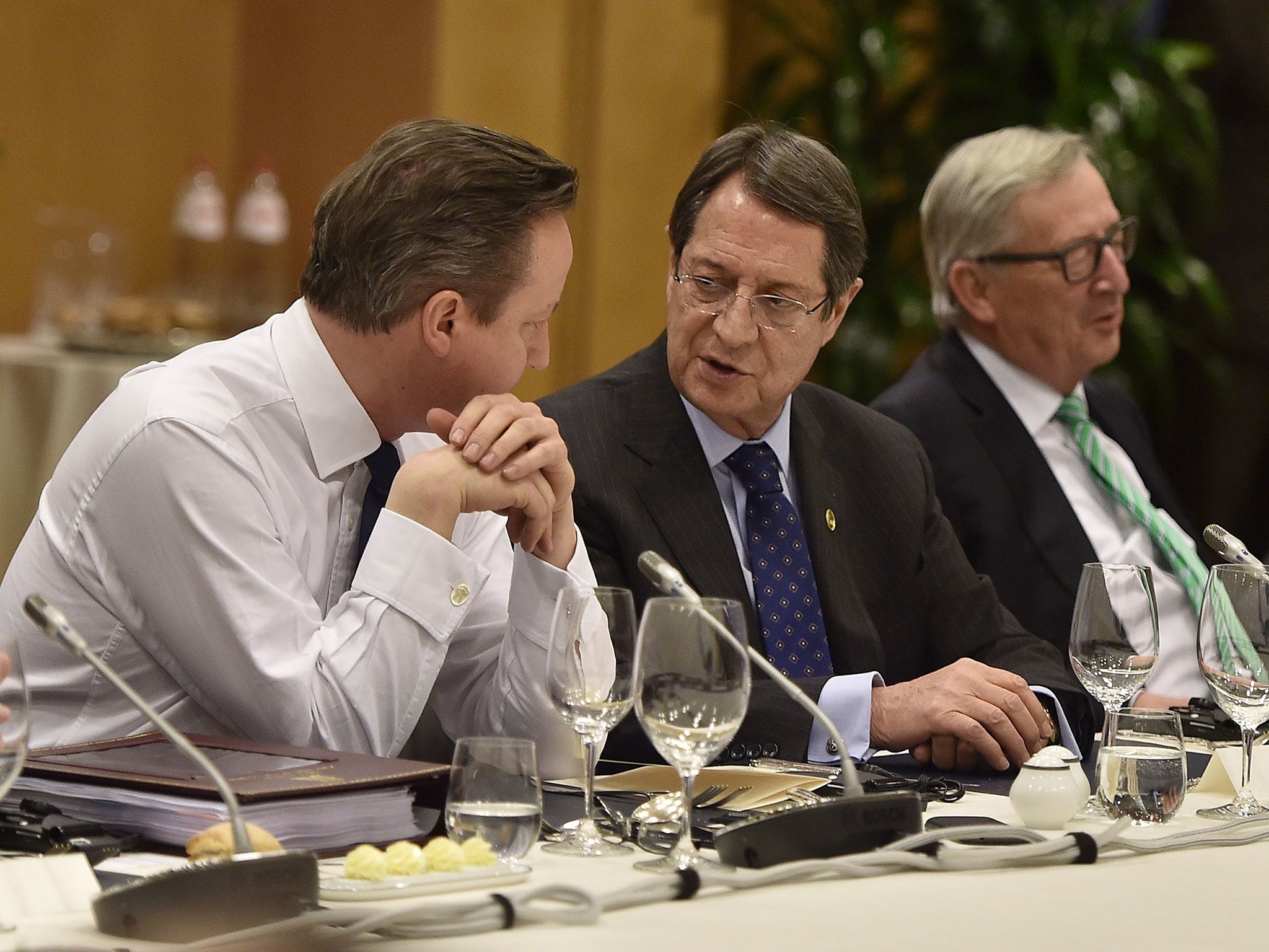 David Cameron discusses details with Cypriot President Nicos Anastasiades and European Commission President Jean-Claude Juncker
