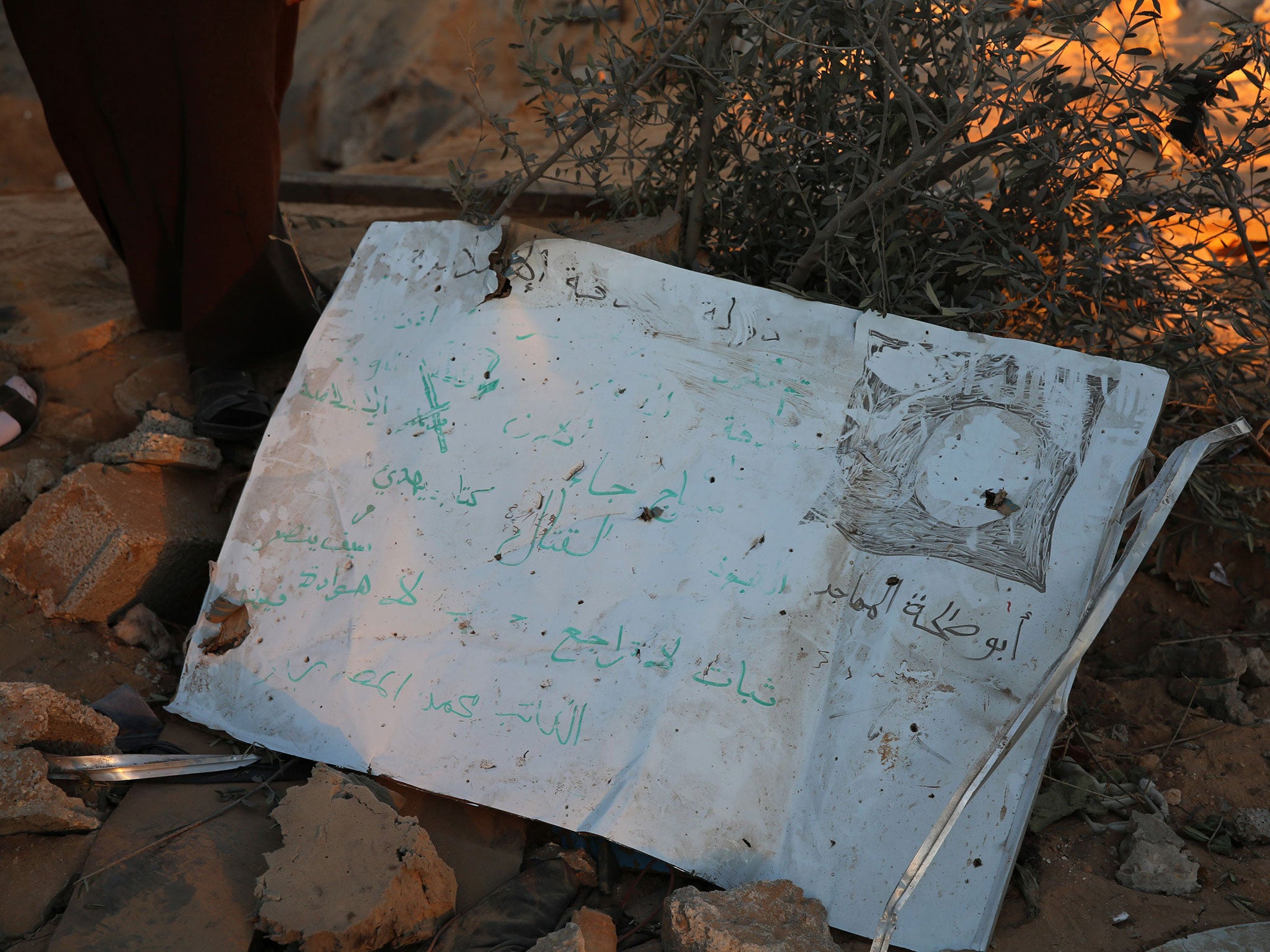 A piece of metal with Arabic writing and the Isis flag, after US air strikes hit a terror training camp west of Sabratha, Libya in 2016