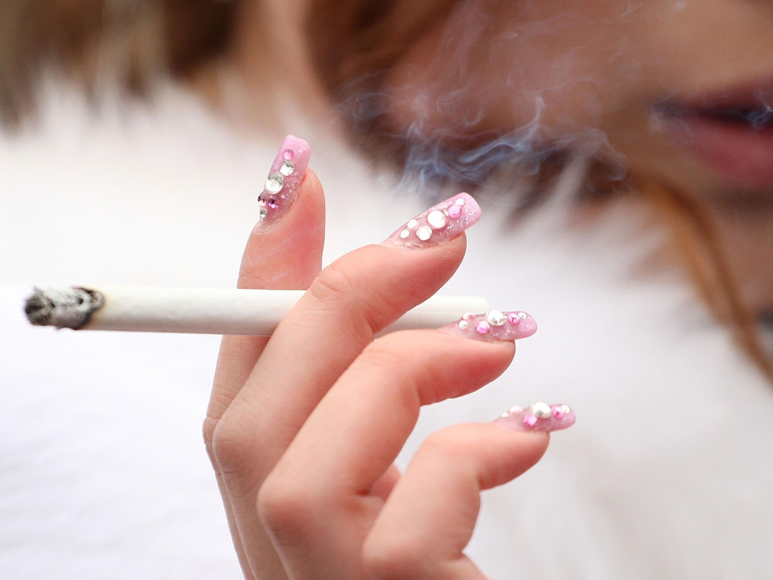 More young women are smoking, as the rate of young male smokers continues to drop