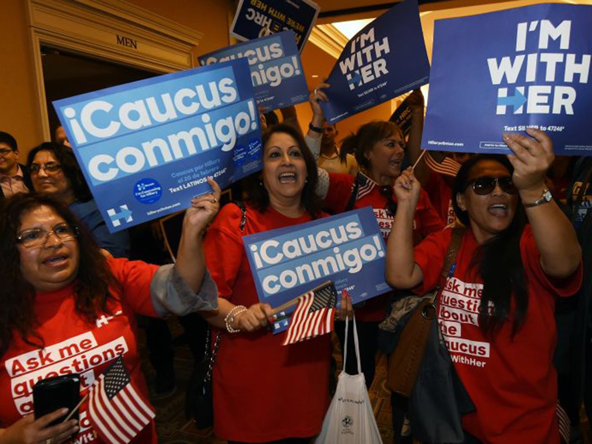 Hillary Clinton supporters celebrate their candidate's narrow victory in the Nevada vote