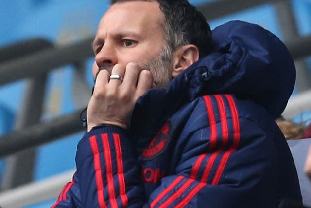 Ryan Giggs looks on from the stand