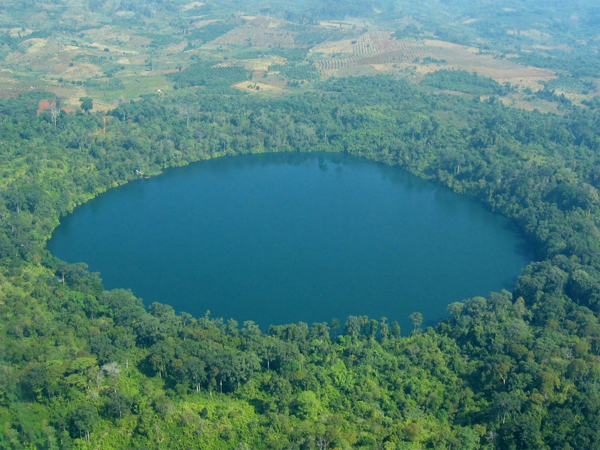The lake is a popular tourist destination surrounded by protected woodland