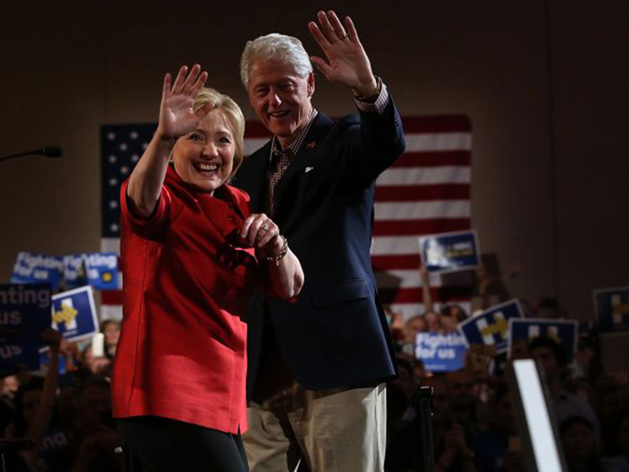 Bill and Hillary Clinton greet supporters during a caucus day event at in Las Vegas