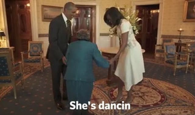 Obamas dancing with 106-year-old woman