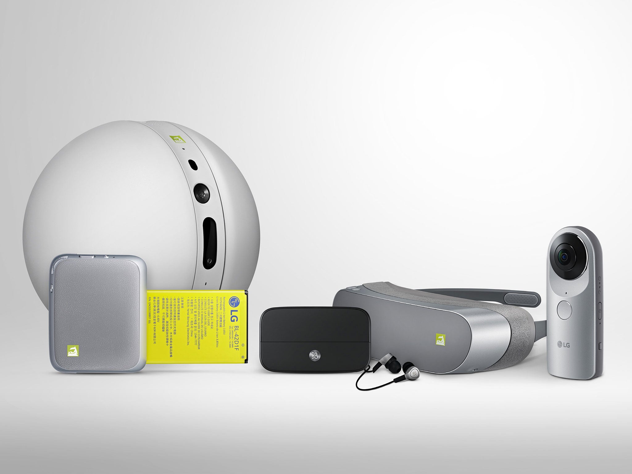 The full range of LG's 'Friends' for the G5 - (L-R) the LG Rolling Bot, the CAM Plus extended battery/camera control pack, the Bang and Olufsen DAC, the LG 360 VR headset, and the LG 360 CAM