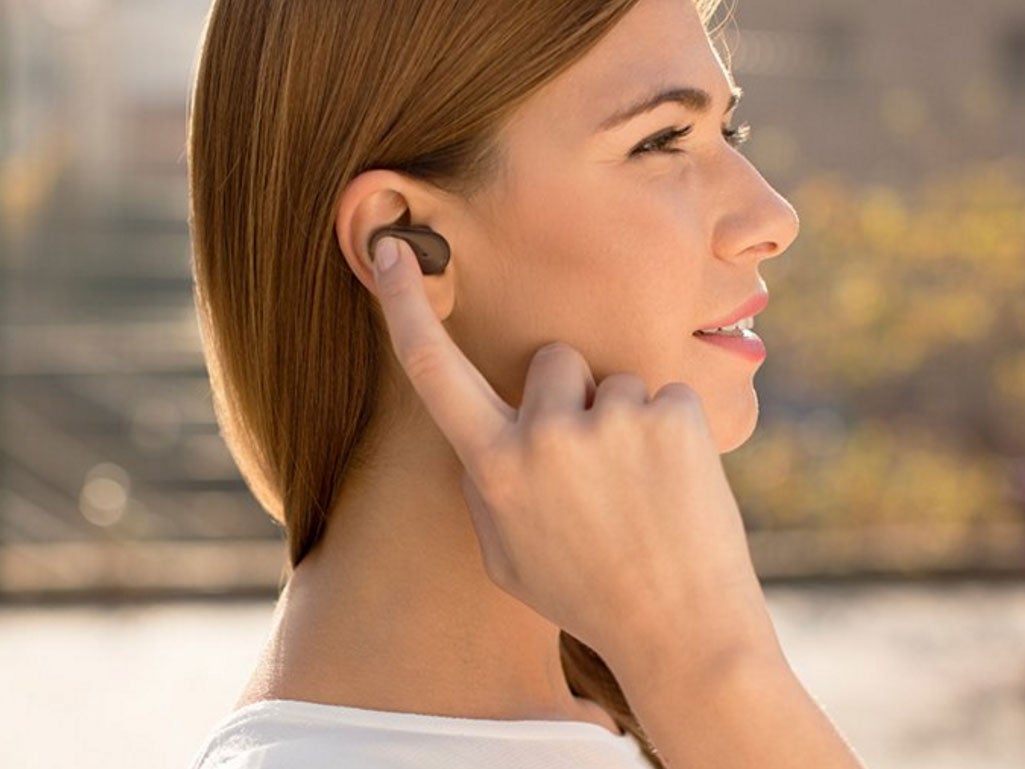 A woman uses the Sony Xperia Ear