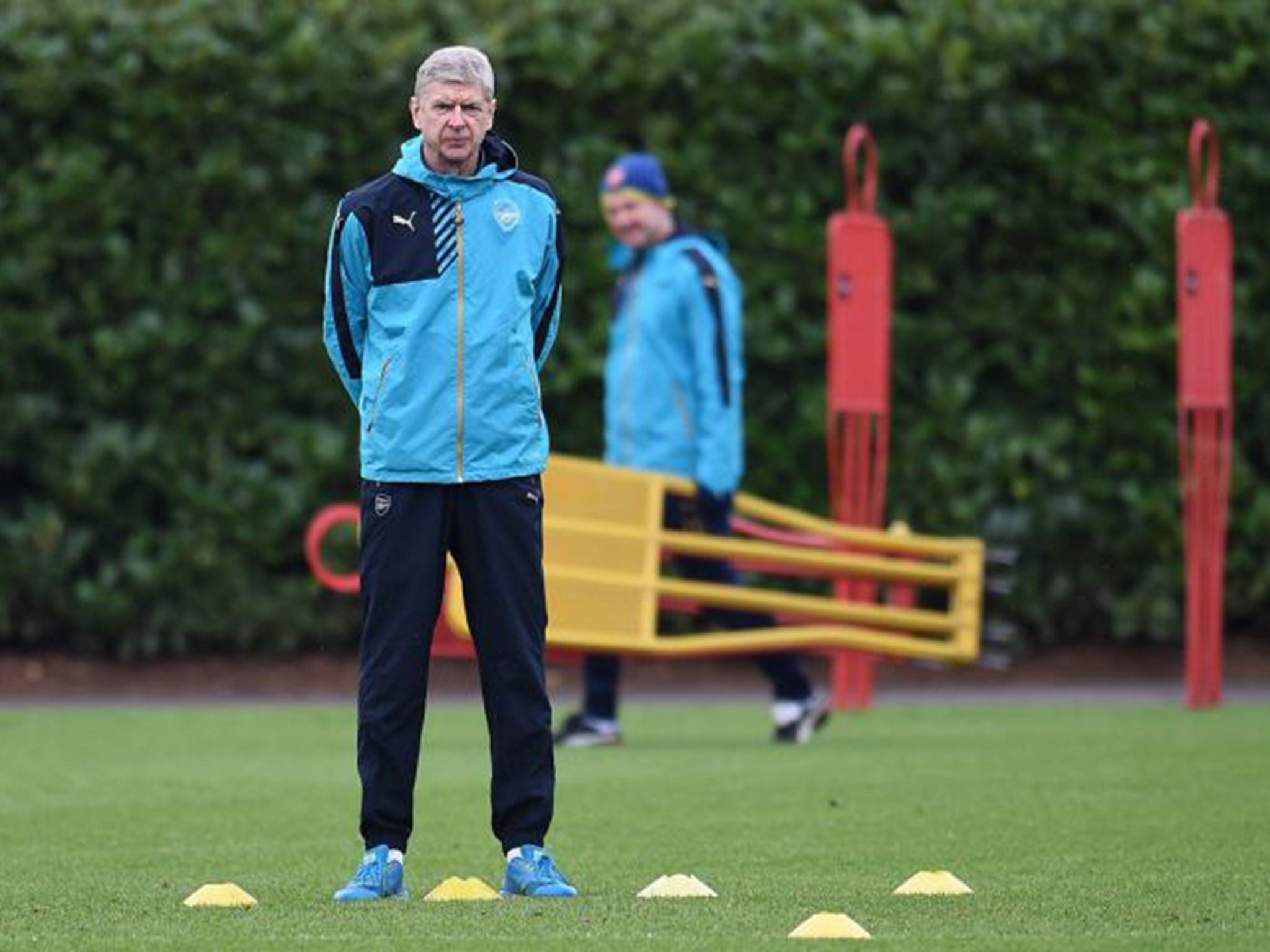 Wenger prepares for the match against Barcelona during Arsenal training on Monday