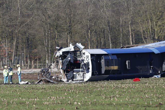 Emergency services intervene on the scene of a derailed passengers train near Dalfsen, eastern Netherlands, on 23 February, 2016