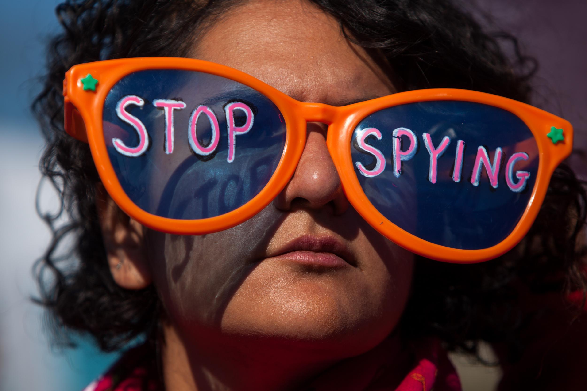 A woman protests against NSA surveillance in front of the US Capitol building in Washington, D.C. in 2013
