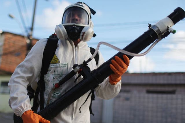 A health worker fumigates in an attempt to eradicate the mosquito which transmits the Zika virus in Recife, Pernambuco state, Brazil.