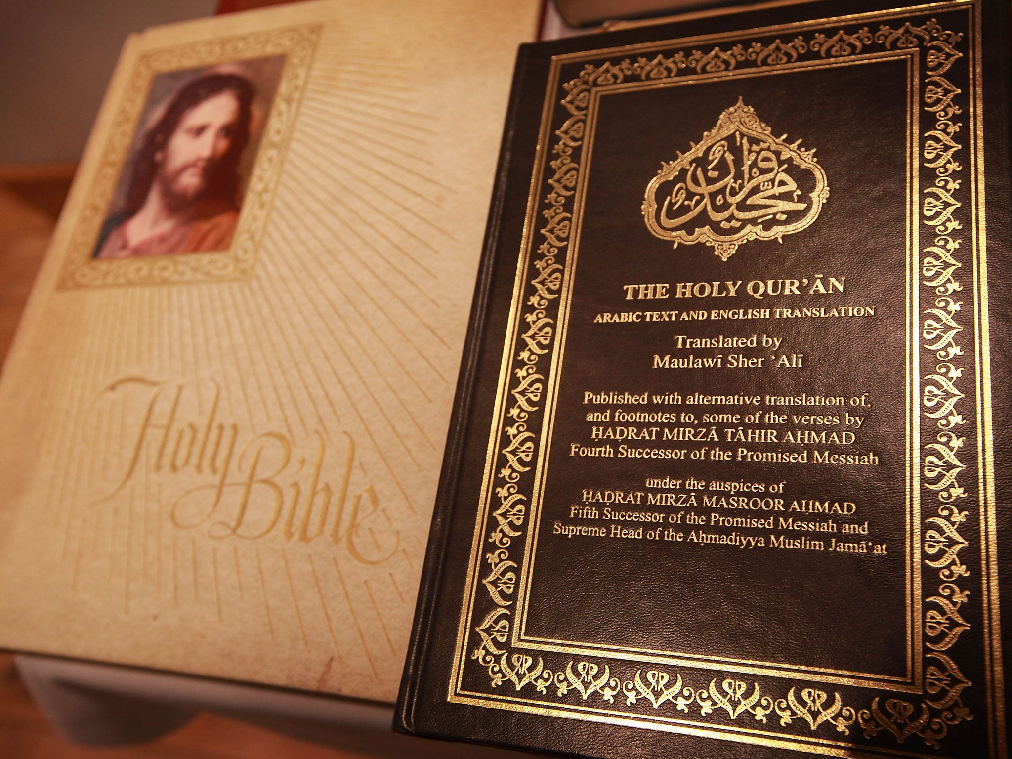 A copy of the Quran is displayed with a bible in the library of the Baitul Futuh Mosque in Morden on September 10, 2010 south of London, England.