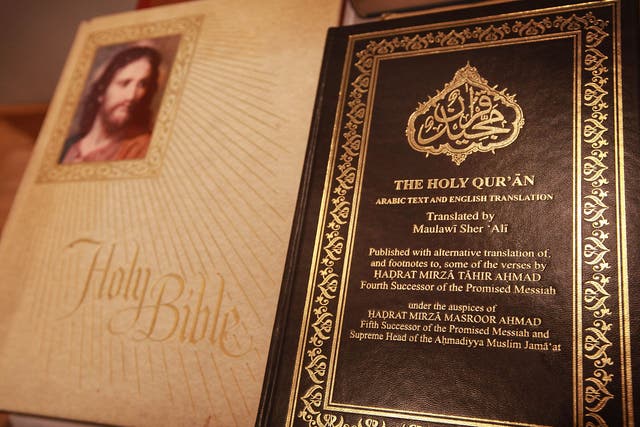 A copy of the Quran is displayed with a bible in the library of the Baitul Futuh Mosque in Morden on September 10, 2010 south of London, England.