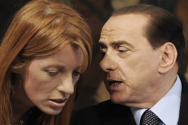 Silvio Berlusconi, then Italian prime minister, with Michela Brambilla, an animal rights activist and the minister for tourism in his government, in 2009