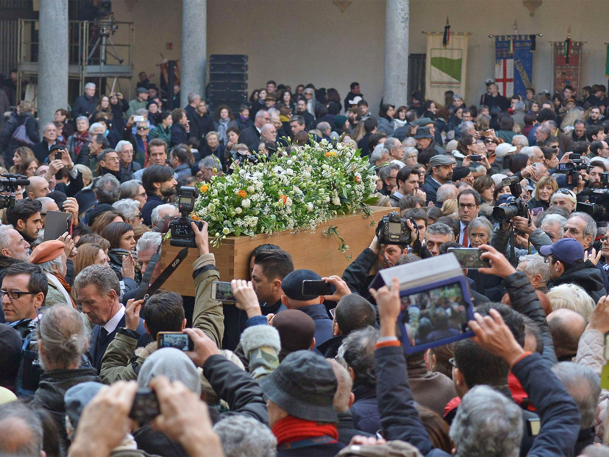 Men carry the coffin of late Italian novelist Umberto Eco, at the Sforza Castle in Milan