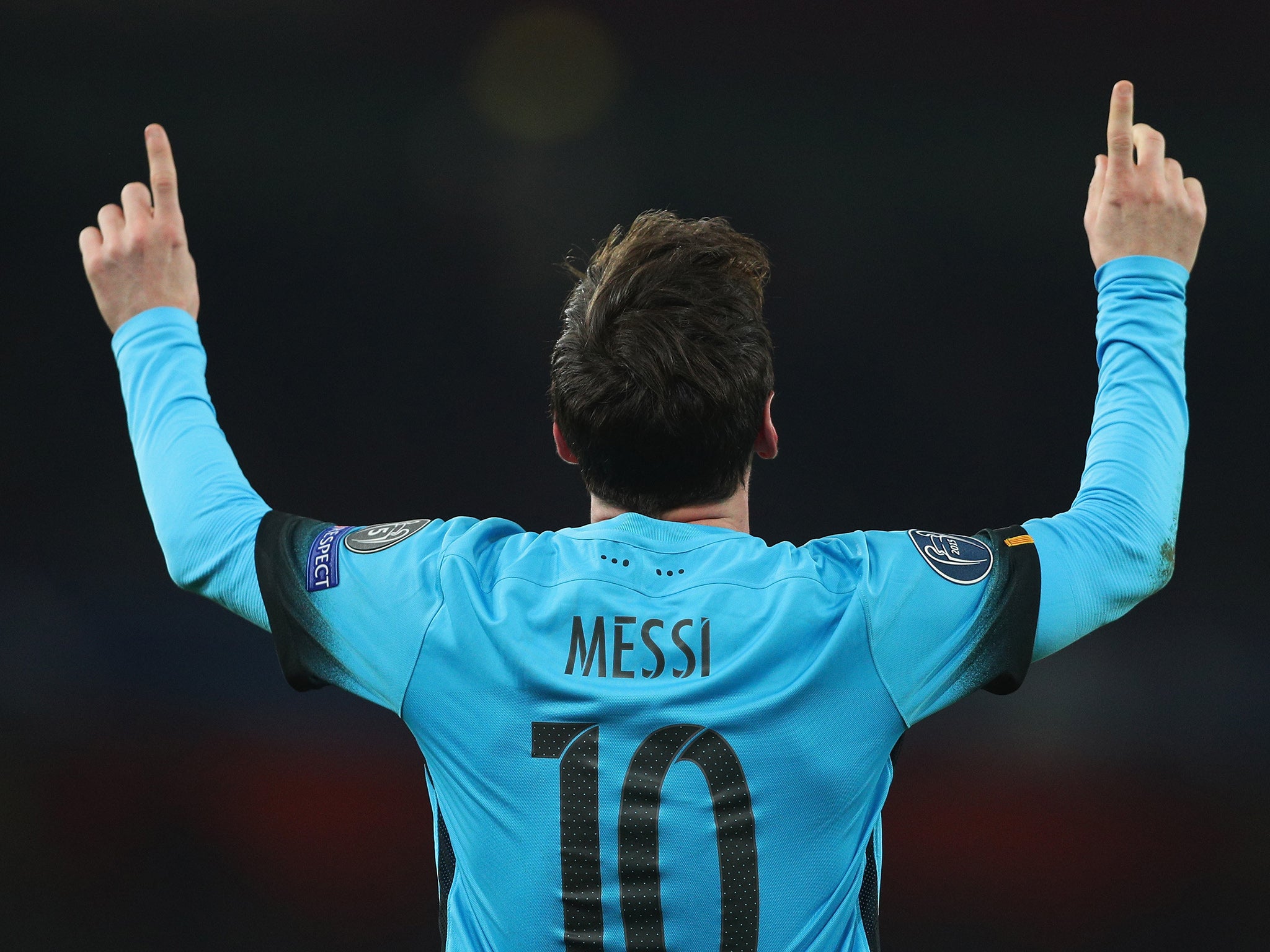Lionel Messi celebrates his second goal against Arsenal