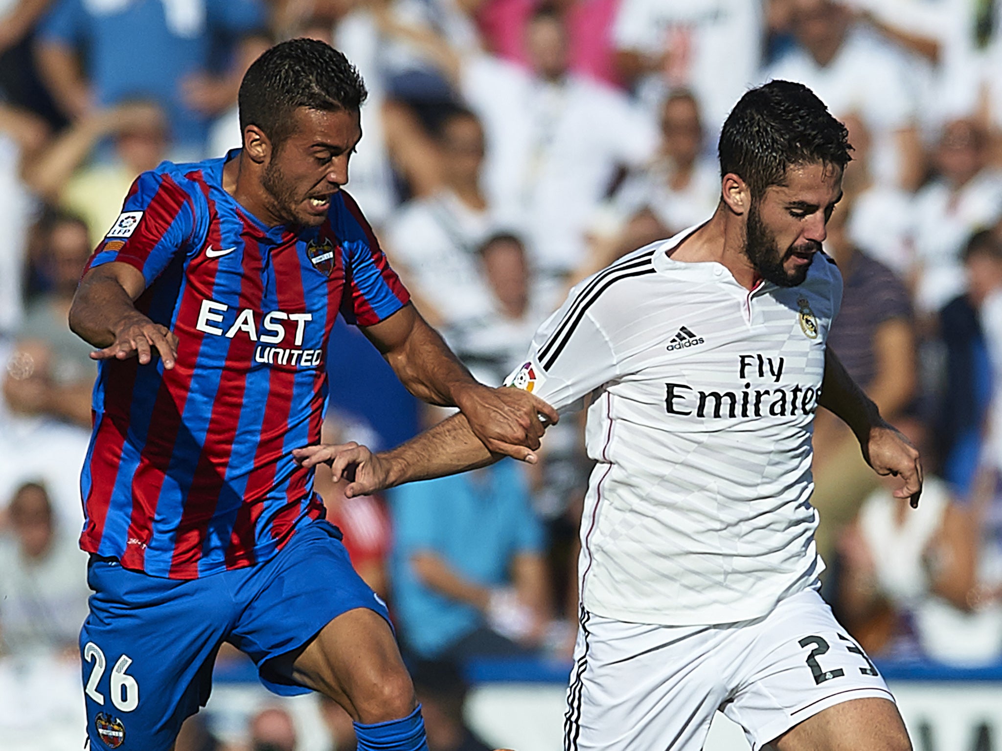 Levante's Victor Camarasa comes up against Real Madrid's Isco