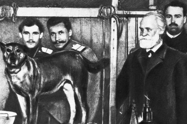 Ivan Pavlov, right, with one of the dogs he was experimenting on
