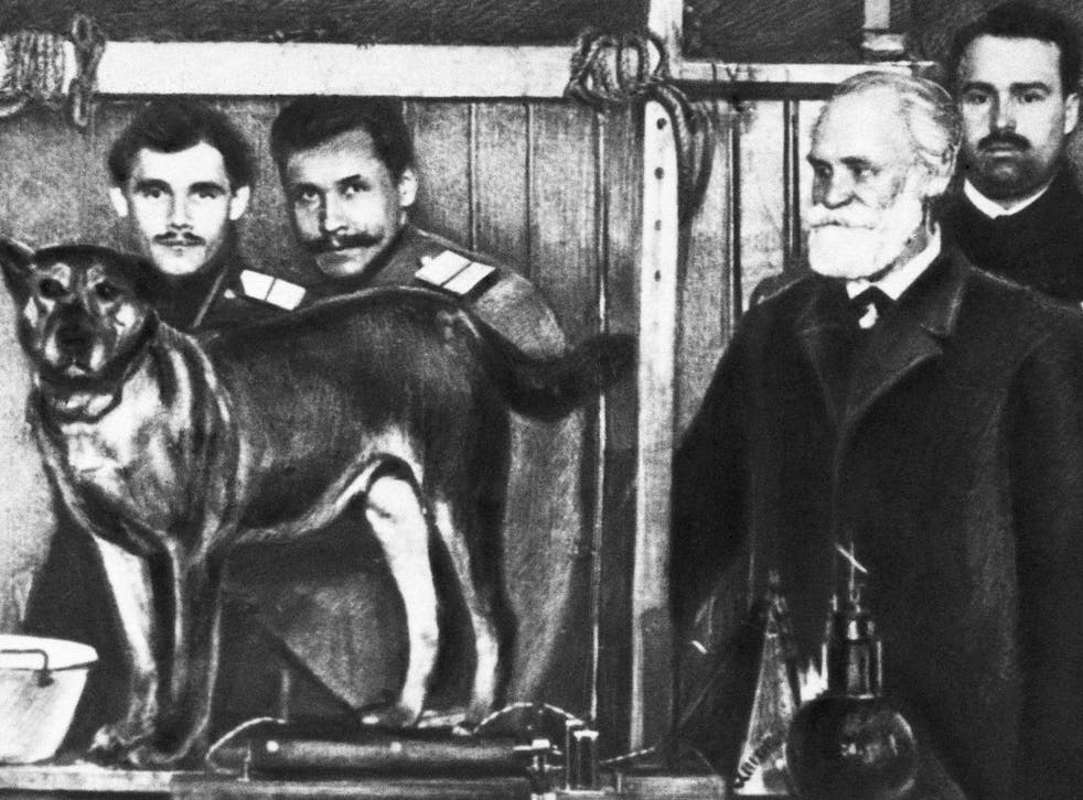 Ivan Pavlov, right, with one of the dogs he was experimenting on