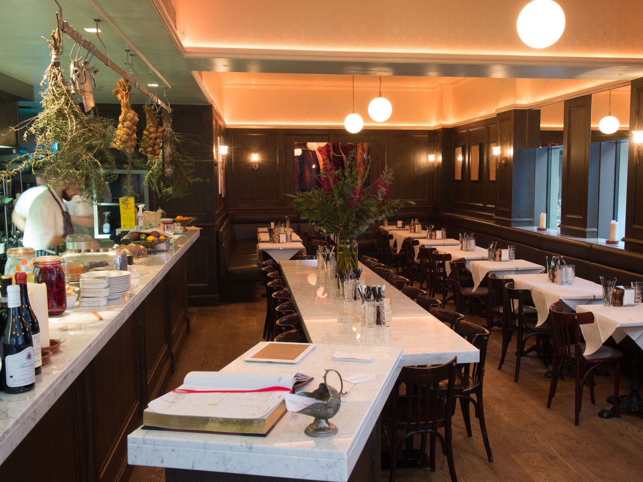 The restaurant has the feel of a traditional City dining room temporarily occupied by YBAs