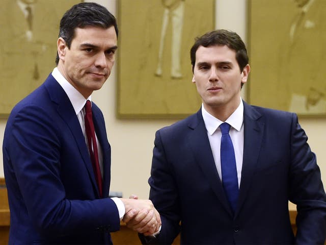 Socialist leader Pedro Sanchez and leader of centre-right party Ciudadanos, Albert Rivera, shake hands after signing an agreement to support Mr Sanchez as candidate to lead the new Spanish government
