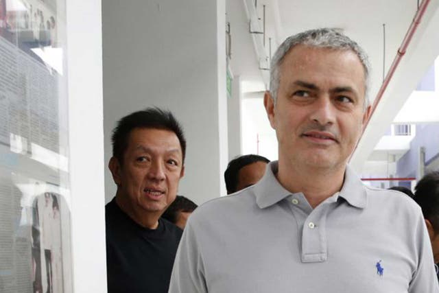 Jose Mourinho with Valencia owner Peter Lim in Singapore