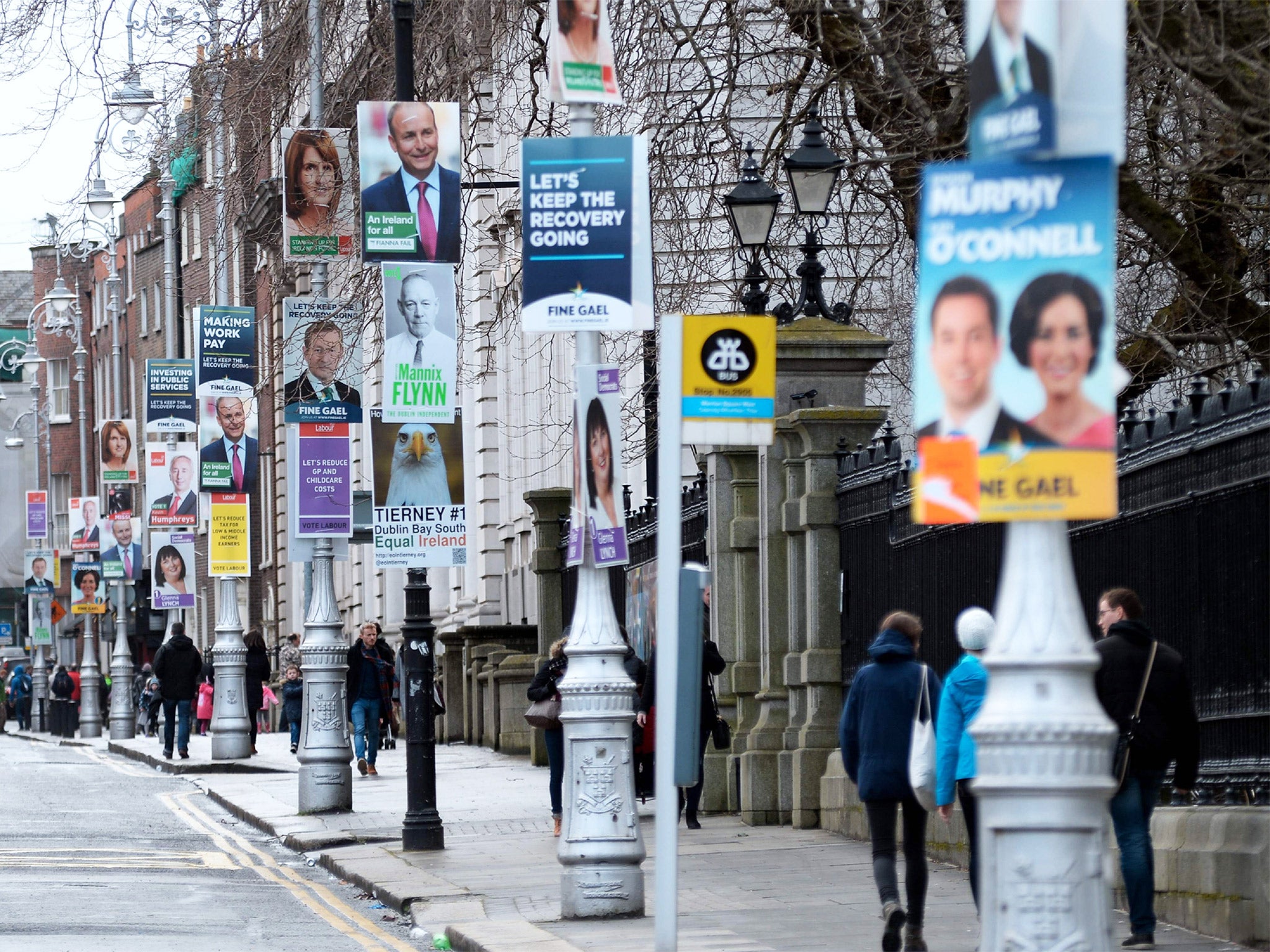 Election posters dominate the view outside Government Buildings in Dublin but almost 30 per cent of the electorate is expected to abandon the traditional parties in favour of independents
