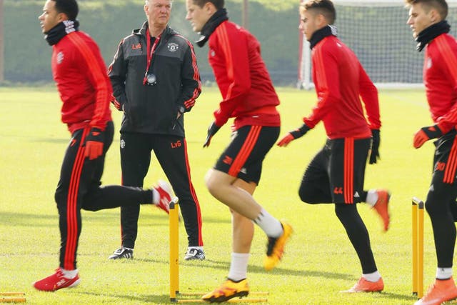 Manchester United manager Louis van Gaal oversees training