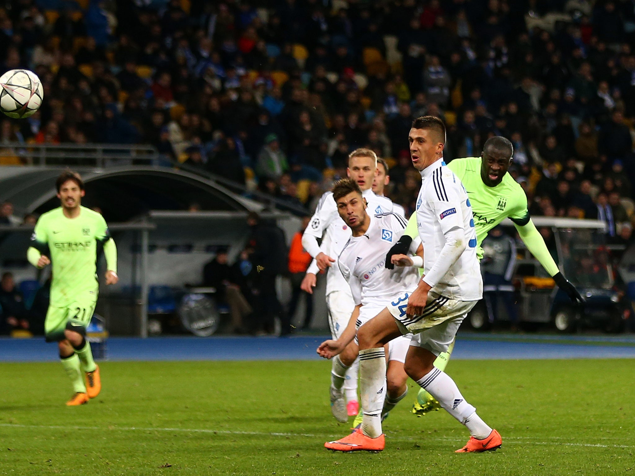 Yaya Toure curls in City's third goal of the game