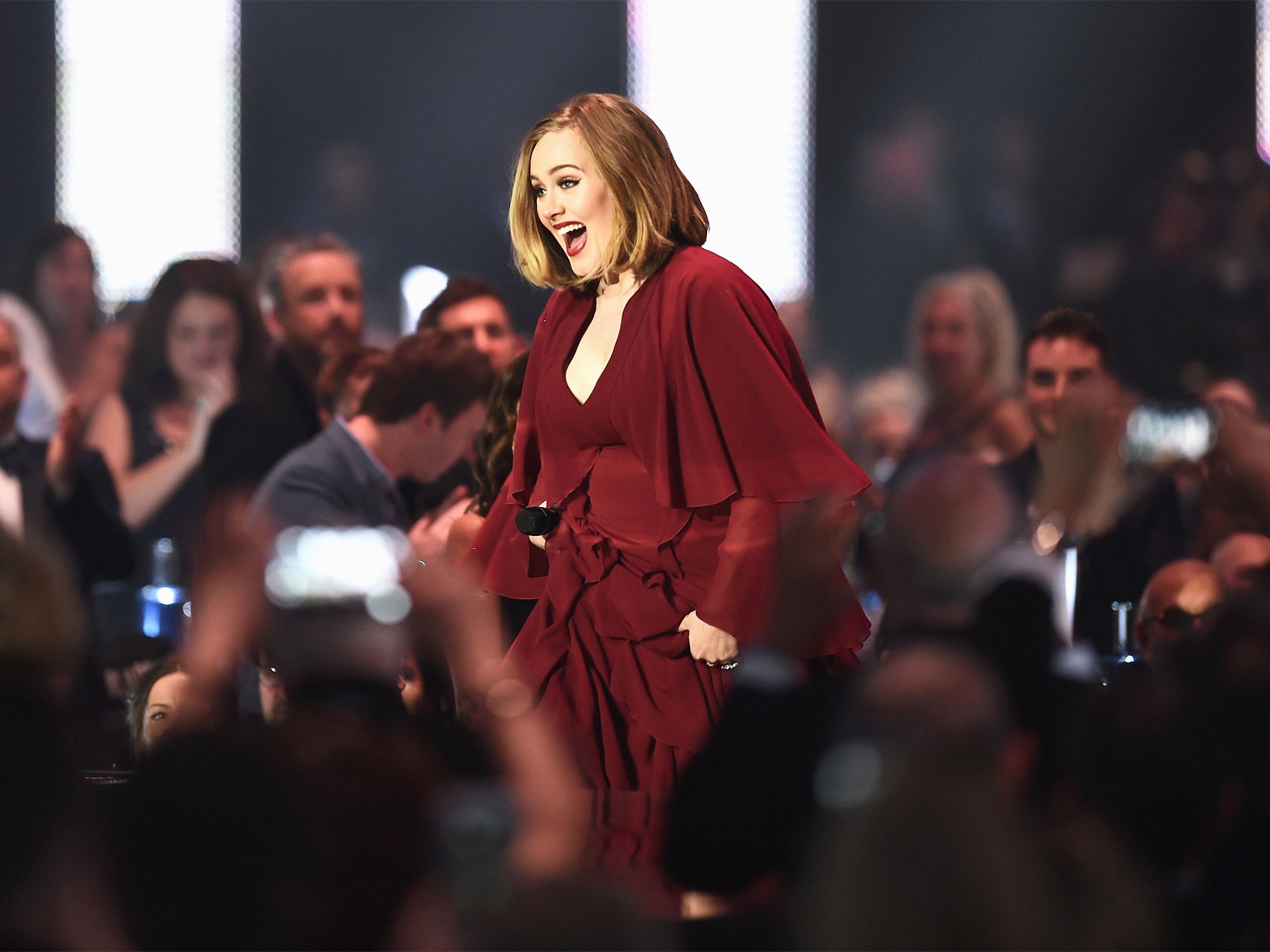 Adele makes her way to the stage to collect one of her four awards