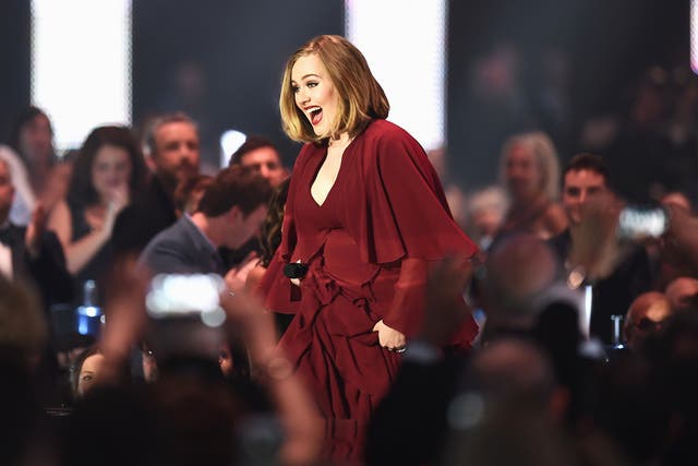 Adele makes her way to the stage to collect one of her four awards
