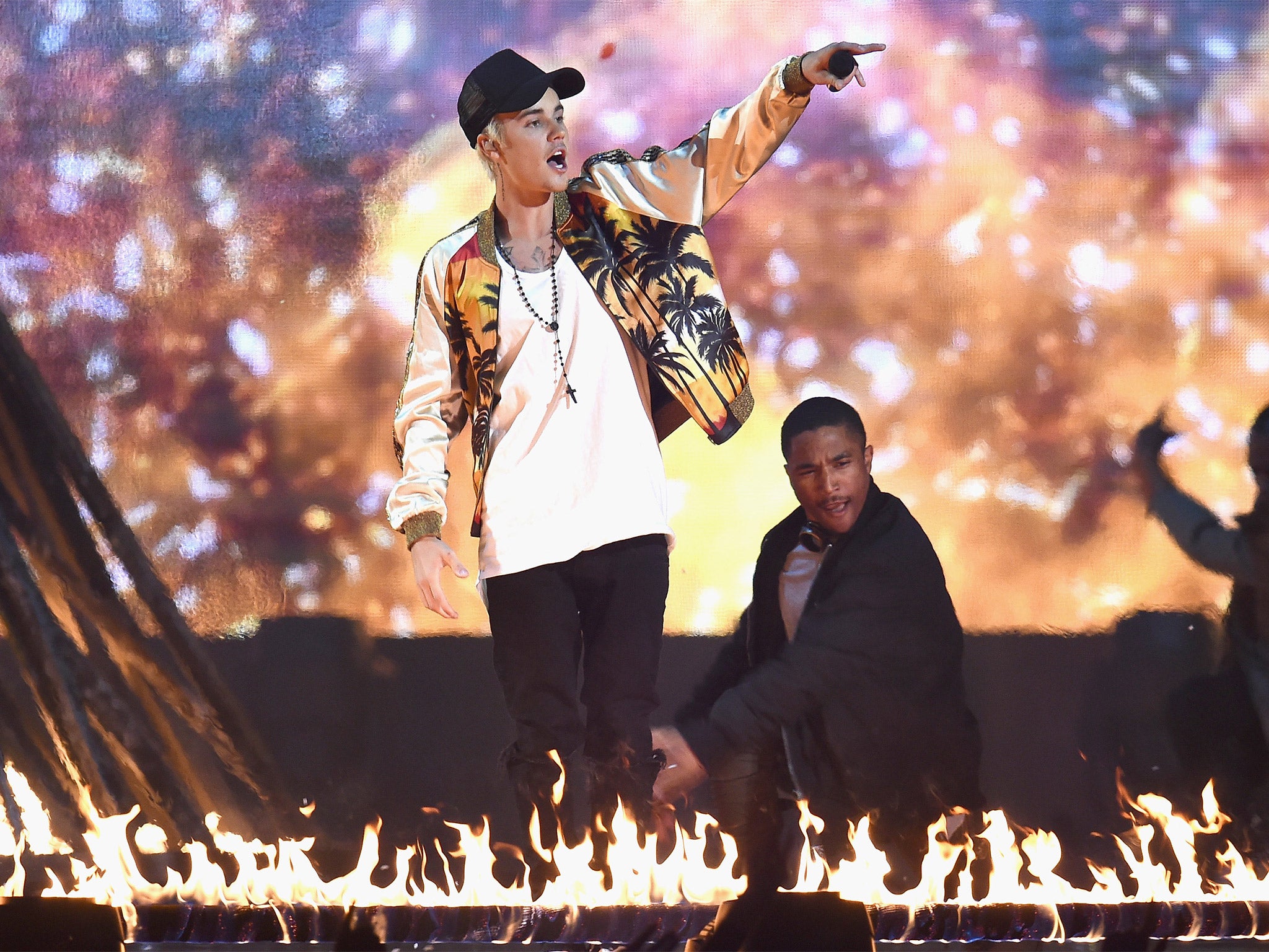 Lighting it up: Justin Bieber performs on stage during the ceremony (Getty)