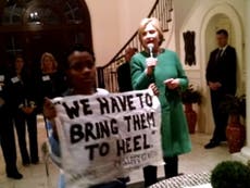 Hillary Clinton told by activists 'you owe black people an apology'