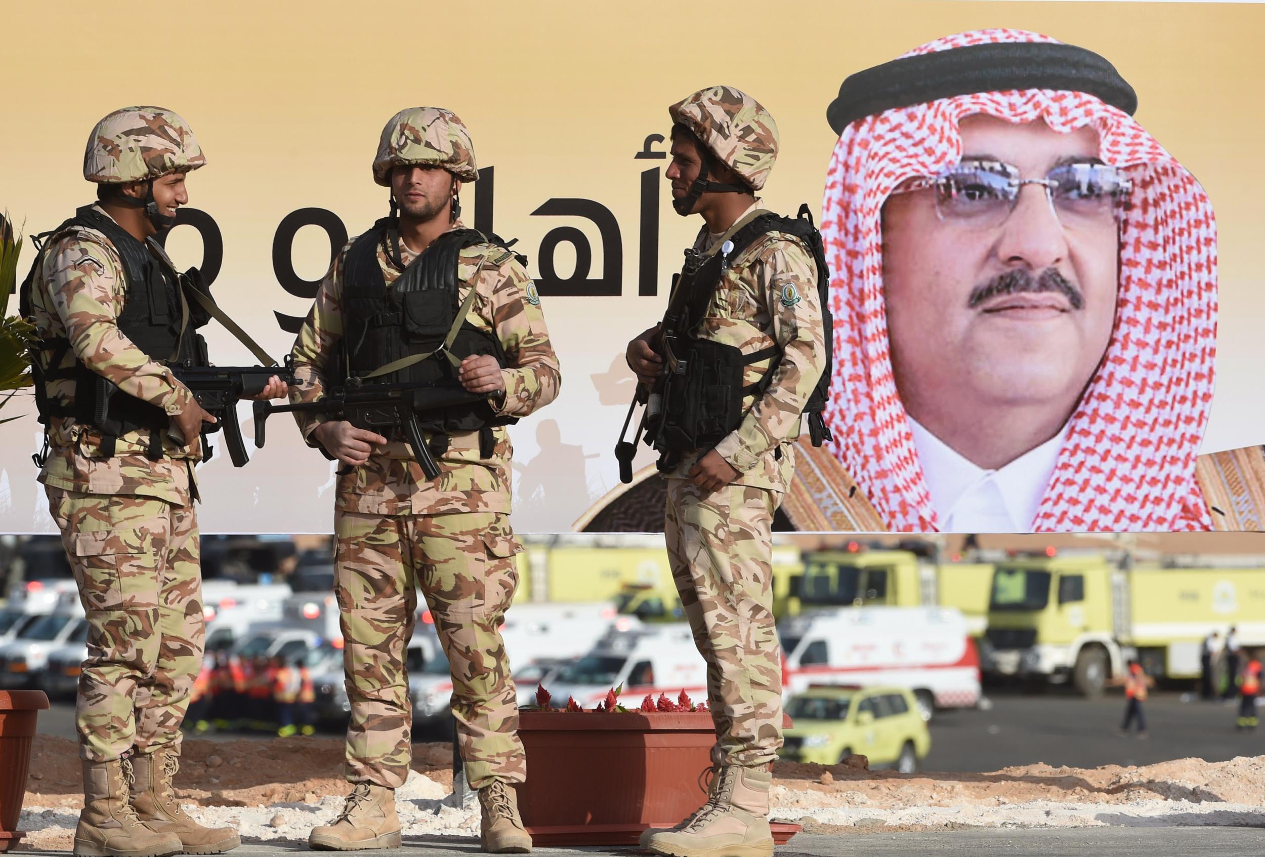 Saudi Arabian special forces stand in front of a picture of the country's Interior minister Mohammed bin Nayef