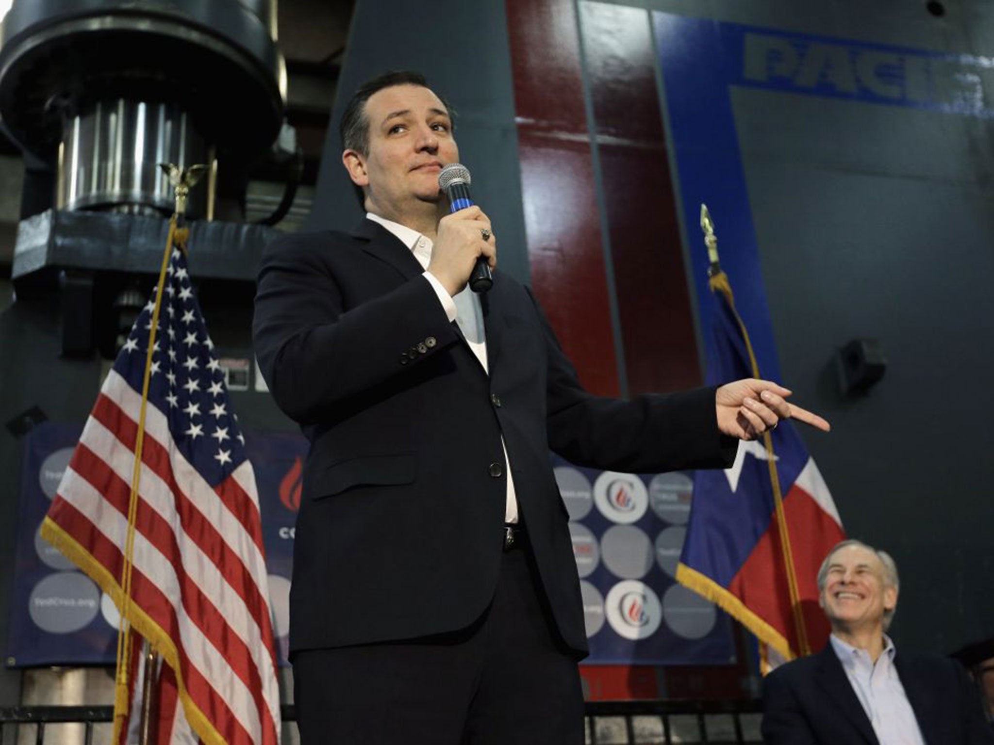 Ted Cruz speaks at a rally in Houston, accompanied by Texas governor Greg Abbott