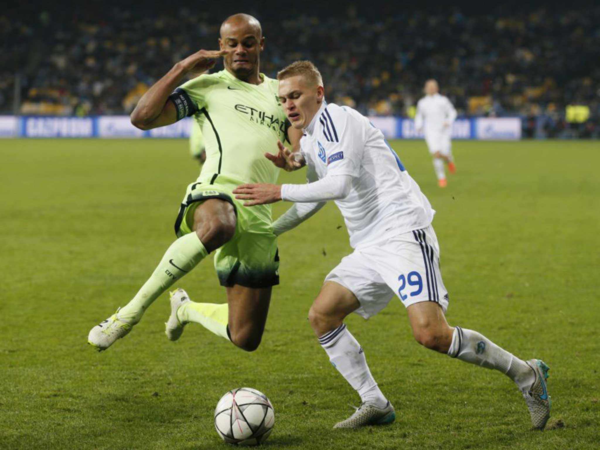Manchester City's Vincent Kompany (left) in action against Dynamo Kiev