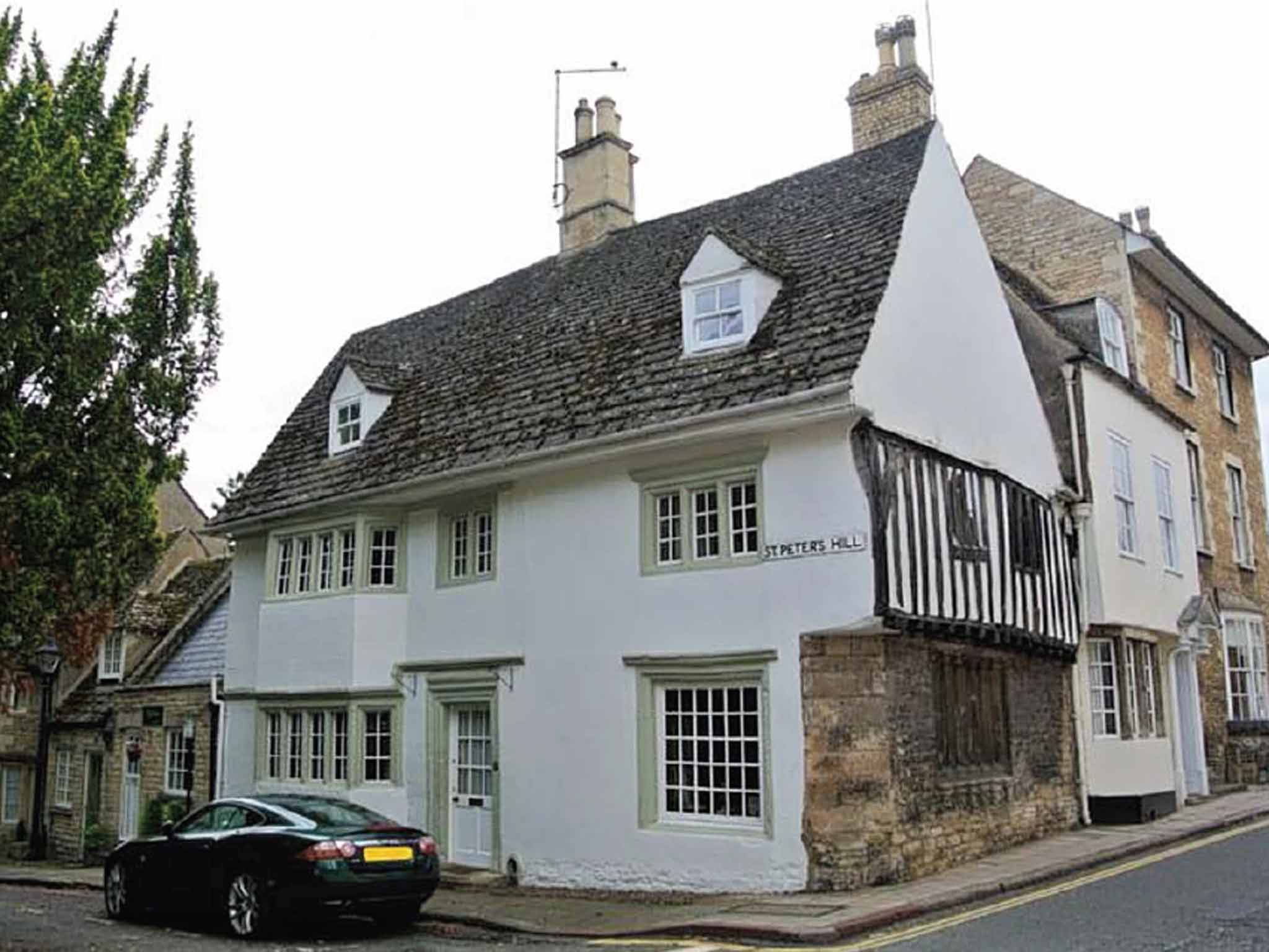 This Grade II three/four bedroom semi-detached house on St Peters Hill, Stamford, has rooms over four levels. It features stone mullion windows, exposed stonework, and a fireplace. On for £350,000 with Newton Fallowell